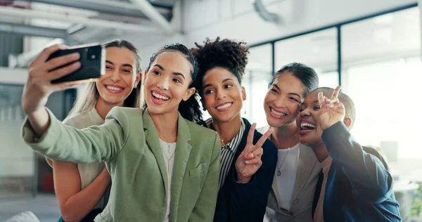 Selfie, friends and business with a black woman group posing for a profile picture together in the office at work. Social media, partnership and teamwork with female colleagues taking a photograph.