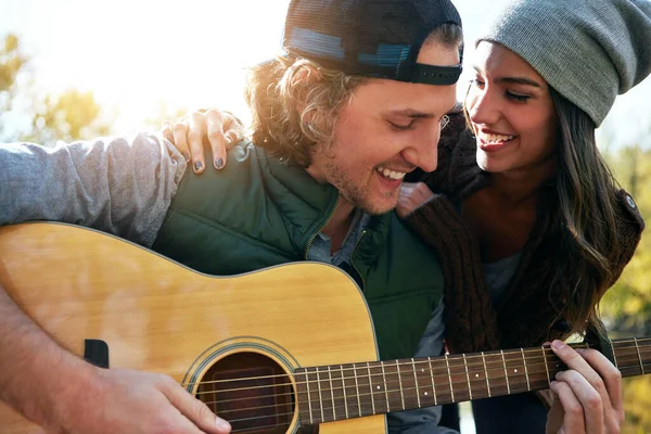 stock image Now I love you even more. a young man playing his girlfriend a song on his guitar