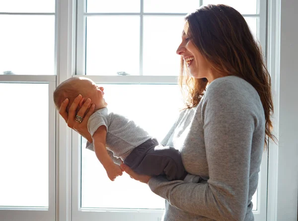 stock image Sweet bundle of joy. a mother holding her newborn baby