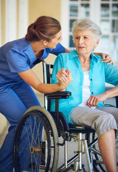 stock image She puts her patients at ease. a doctor caring for her senior patient at a nursing home