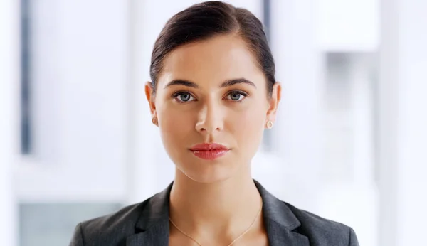 stock image Time to handle some serious business. Portrait of an attractive young businesswoman looking serious in her office