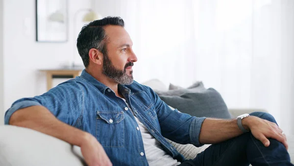 stock image I think Ill go for a walk later. a middle aged man relaxing at home