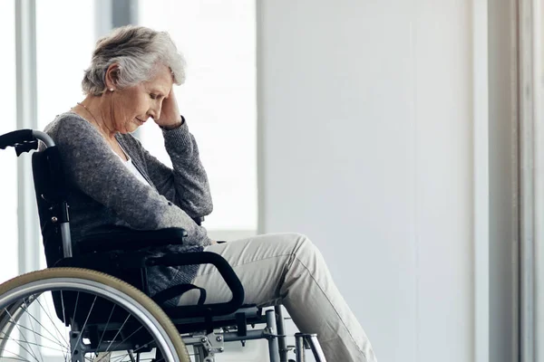 stock image I hope someone comes to visit today. a senior woman sitting in a wheelchair