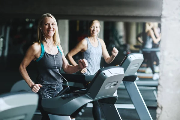 stock image Getting fit will make you feel good. mature women working out in the gym