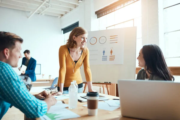 Stock image Teamwork, the greatest predictor of success. a group of young businesspeople having a meeting in a modern office