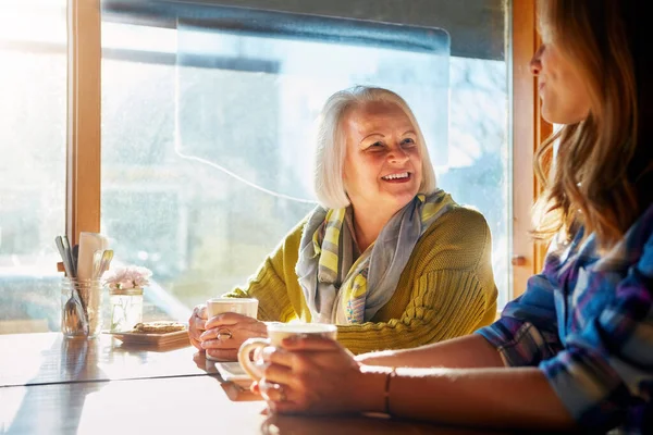 stock image So whats been new in your life. a young woman and her senior mother bonding together in a cafe