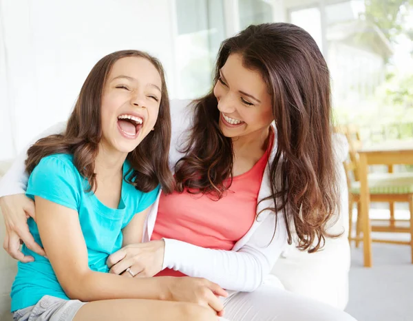 stock image Memories in the making. A mother tickling her daugher while her daughter laughs in a moment of bonding