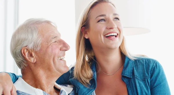 stock image The kind of bond that never outgrows time. a young woman spending quality time with her father at home