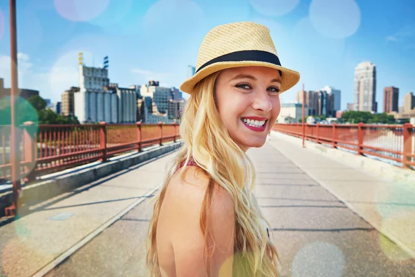 stock image Big cities set you up for success. a smiling young woman walking around the city in the summertime