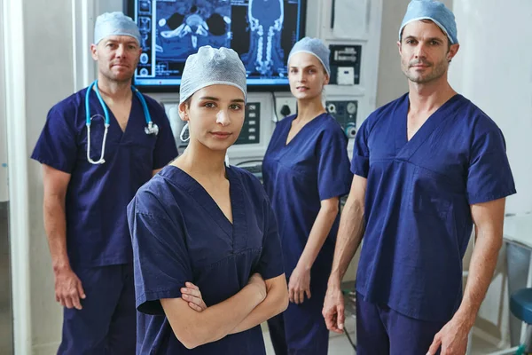 stock image We put a lot of love into what we do. Portrait of a team of surgeons in a hospital