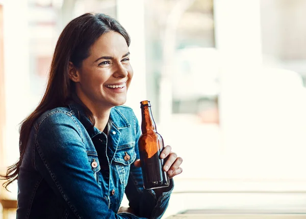 stock image Beer makes everything seem funny. young people having beers at a bar