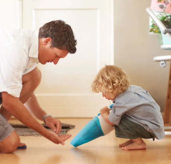 Boy Father Vacuum Floor Learning Support Cleaning Family Home Together Royalty Free Stock Photos