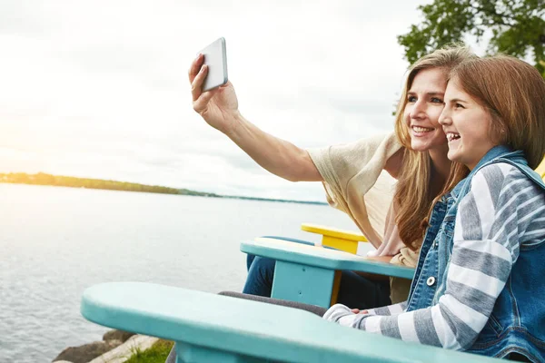 stock image One day well look back fondly on this day. a mother and her daughter taking a selfie together outdoors