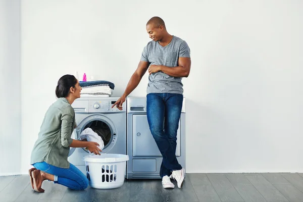 stock image Hey, dont mix colors. a young woman doing laundry at home