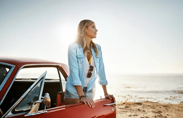 stock image Wide open space, nothing more needed. a beautiful young woman going on a road trip to the beach