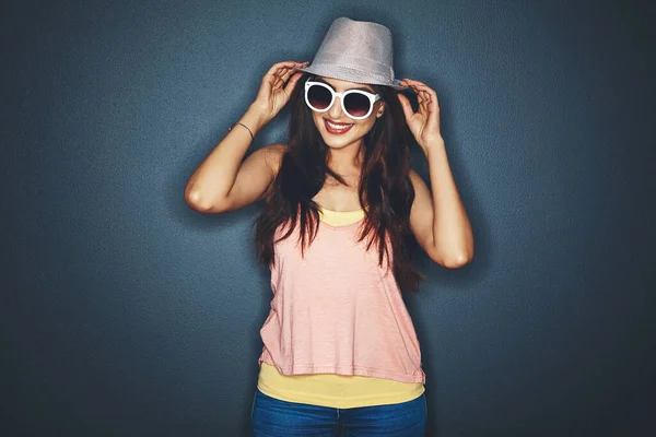 stock image Party mode - on. Studio shot of an attractive and fun loving young woman posing against a dark background