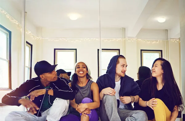 stock image Doing it for the love of dance. a group of young friends hanging out in a dance studio