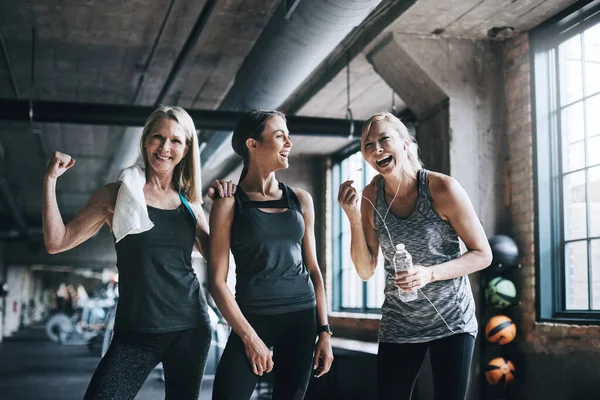 Were stronger together. Cropped portrait of three attractive and athletic women working out in the gym