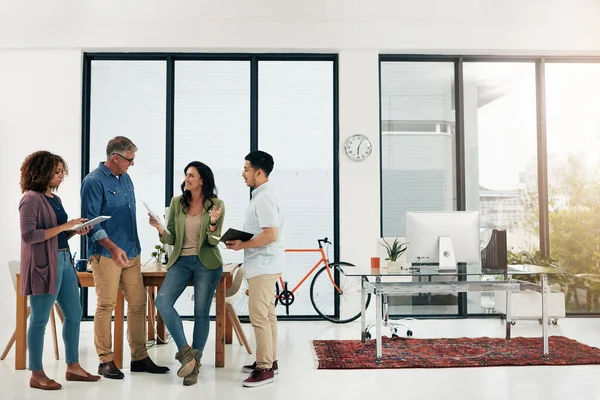 stock image Shes a big thinker. Full length shot of four creative professionals talking in the office