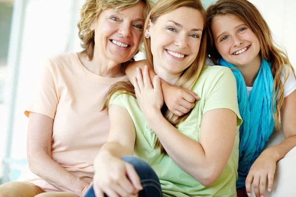 stock image They share the same smile. A beautiful mature woman being hugged by her mother and daughter