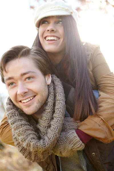 Having Fun Together Young Man Piggybacking His Girlfriend While Outdoors — Stock Photo, Image