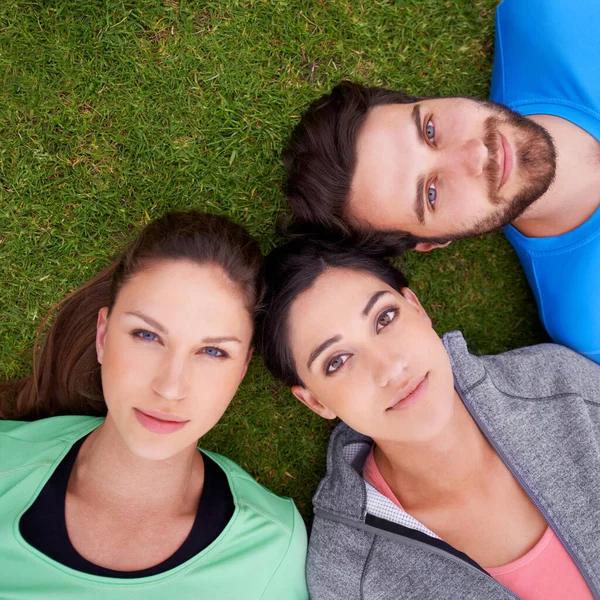 Much Potential High Angle Shot Three Friends Lying Grass — Stock Photo, Image