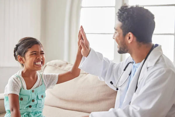 Young Doctor Celebrating Good News His Patient Smiling Girl High — Stockfoto