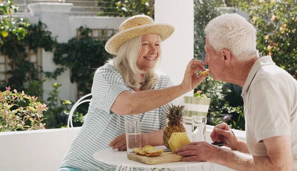 Isnt Delicious Happy Senior Couple Sitting Together Enjoying Snack — Stock Photo, Image