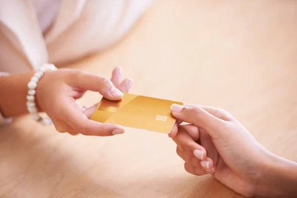 stock image Payment, service and hands of people with a credit card to pay for a booking or reservation. Retail, shopping and a woman giving for transaction, sales and paying for services at a store or reception.