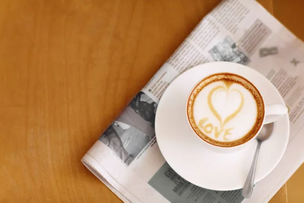 Coffee Cappuccino Heart Foam Newspaper Table People Restaurant Cafe Drink — Stock Photo, Image