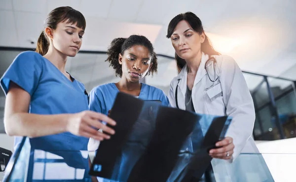 stock image World class team of radiologists. a group of doctors discussing the results of an X-ray in a hospital