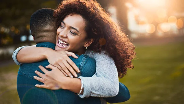 stock image When love leaves you so fulfilled. a young woman hugging her boyfriend outdoors