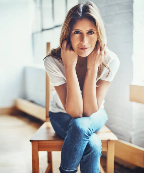 stock image Relaxation is the only thing on the schedule today. Portrait of an attractive young woman relaxing at home