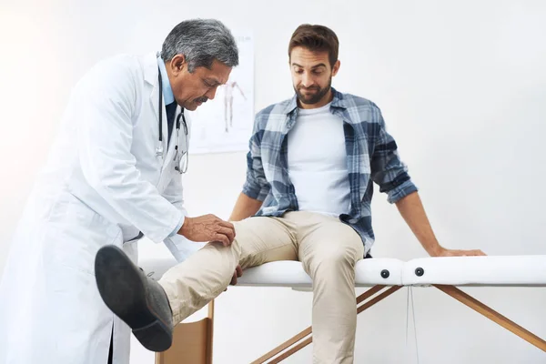Just Relax Tell Hurts Mature Male Doctor Doing Check Young — Stock Photo, Image