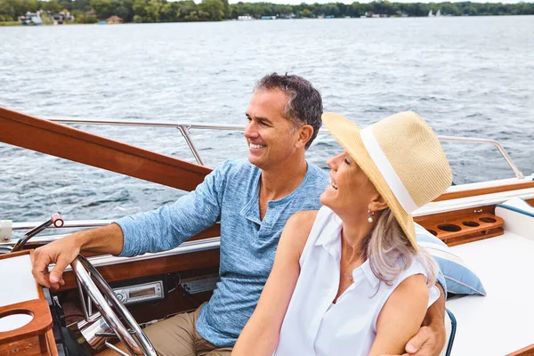 Life is one luxurious boat ride. a mature couple enjoying a relaxing boat ride