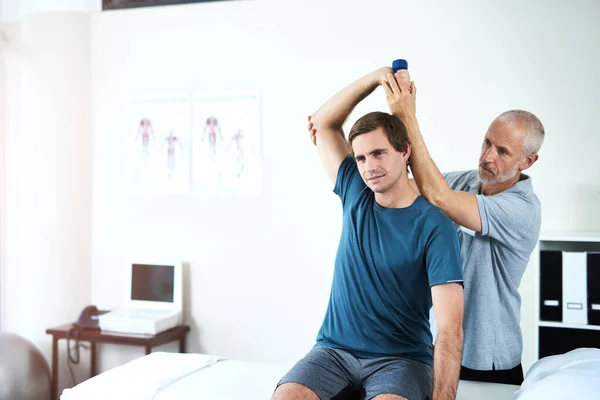 Improving His Range Motion Physiotherapy Handsome Mature Male Physiotherapist Helping — Stock Photo, Image