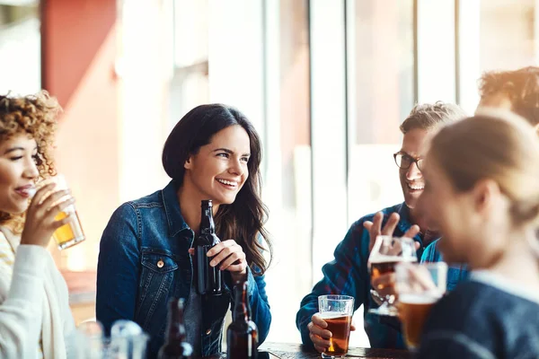 stock image They always have a great time when they get together. a group of friends enjoying some beers at a bar