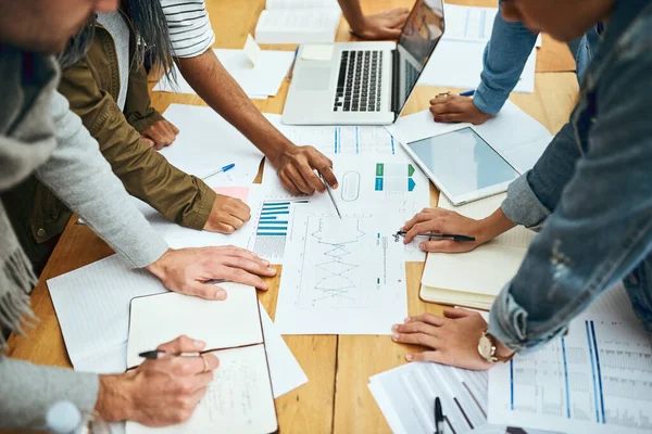 stock image Using every resource available to them. High angle shot of a group of unrecognizable university students studying in the library