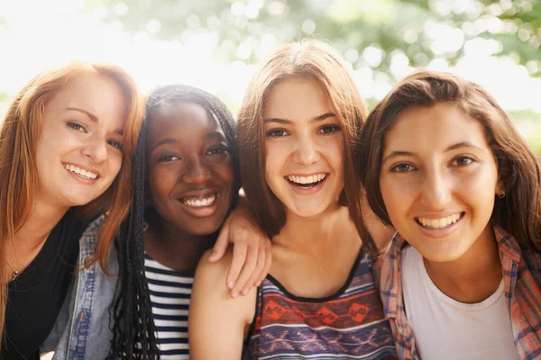 Girl friends, smile and portrait outdoor with diversity in summer on holiday with travel. Female student, sunshine and happiness face of young gen z and teen people together on vacation feeling happy.