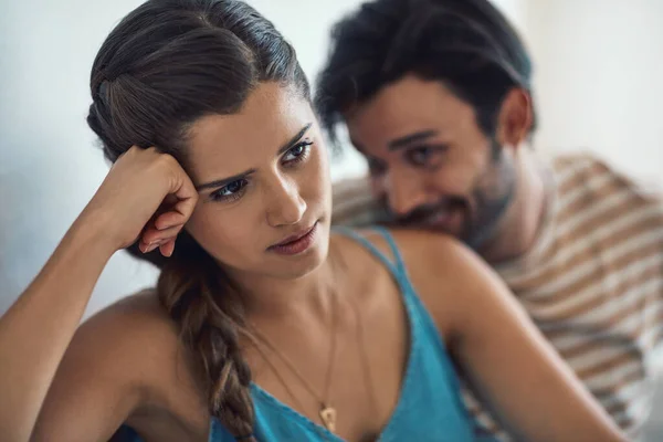 stock image Approach with caution. a young couple having an argument while sitting on their couch at home