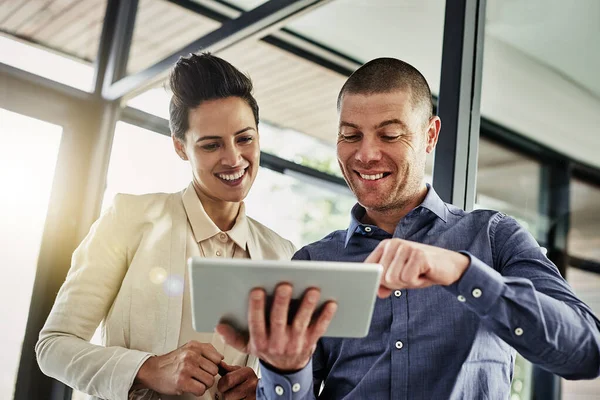 stock image Making positive strides toward success. two colleagues using a tablet while meeting in their office