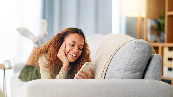 Young Woman Smiling Laughing While Texting Phone Home Cheerful Female — Stock Fotó