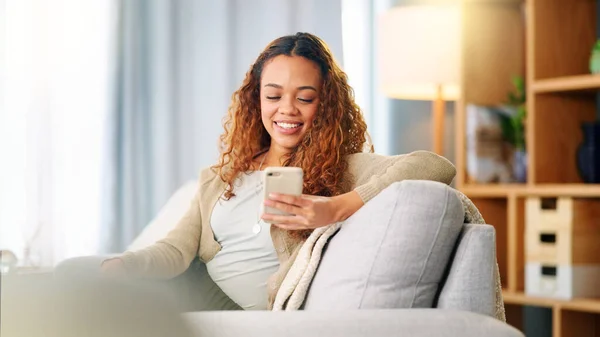 Young Woman Smiling Laughing While Texting Phone Home Cheerful Female — Stock Fotó