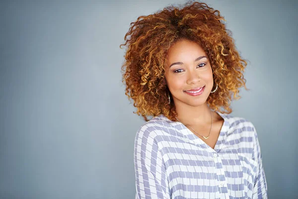 stock image Full of self confidence. Studio shot of a young businesswoman against a gray background