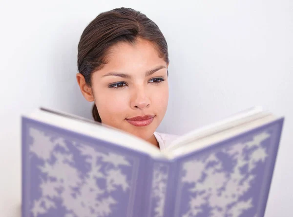 stock image A captivating read...Cropped closeup shot of an attractive young woman reading a book