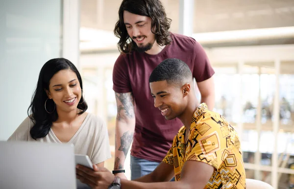 stock image Sparking creativity as a innovative team. a group of businesspeople working together on a digital tablet in an office