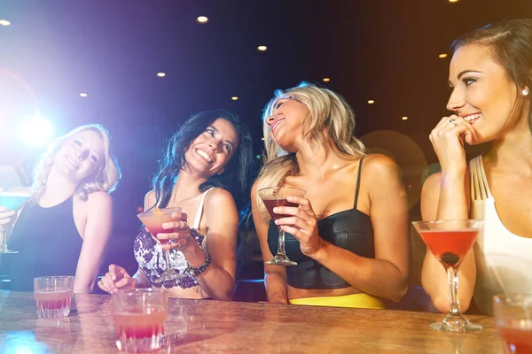 stock image We should do this more often. young women drinking cocktails in a nightclub