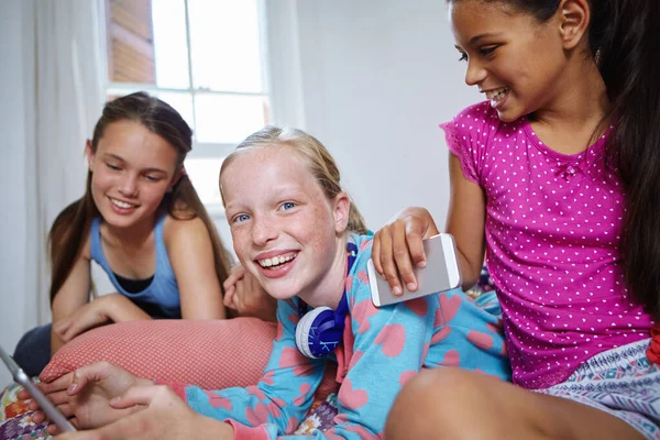 stock image Having a great time with my girls. a group of teenage friends using a digital tablet together