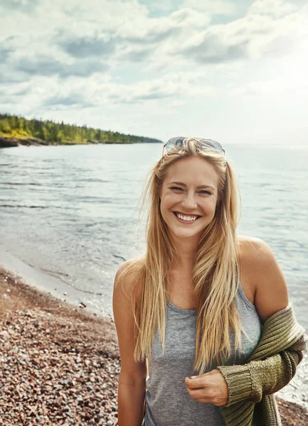 stock image I love it here at the lake. a young woman spending a day at the lake