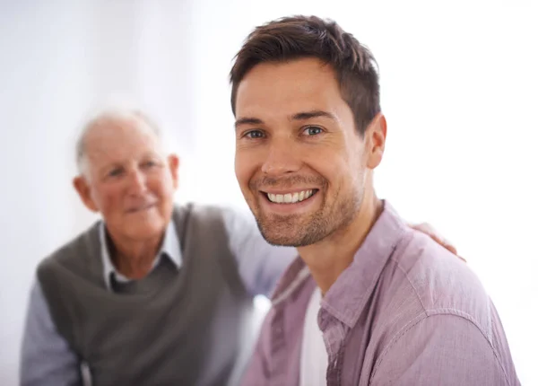stock image Im proud of the man hes become. Portrait of a young man and his senior father bonding at home